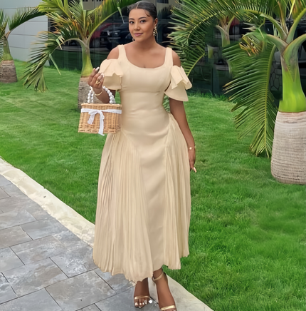 Off-shoulder maxi dress in cream with layered ruffle sleeves and pleated skirt