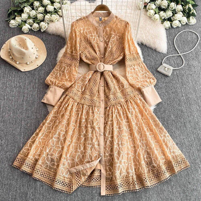 Tan lace mini dress with button front, long puff sleeves, and round-buckle belt