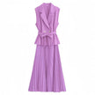 Light-purple sleeveless belted blazer with pleated midi skirt