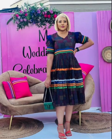 Heritage stripe midi dress with V-neck, puff sleeves, and multicolor horizontal bands