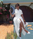 White embroidered dress with short sleeves and V-neck, eyelet detailing