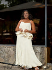 Cream layered ruffle evening dress with spaghetti straps and tiered skirt