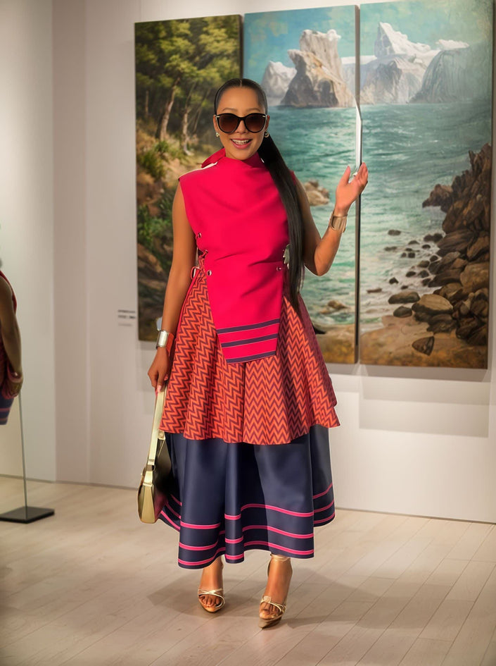 Layered midi dress with red high neck and geometric zigzag hem panels