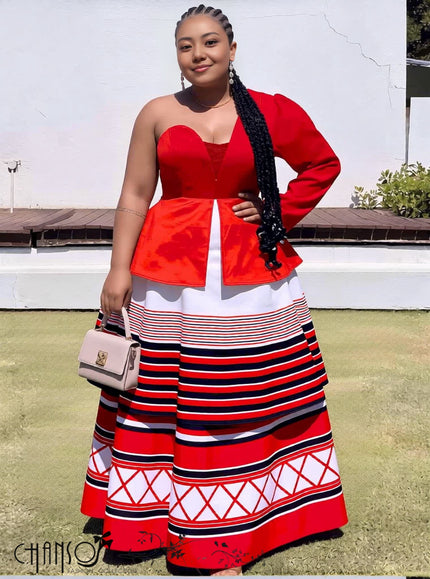 One-shoulder red maxi dress with peplum bodice and striped geometric skirt