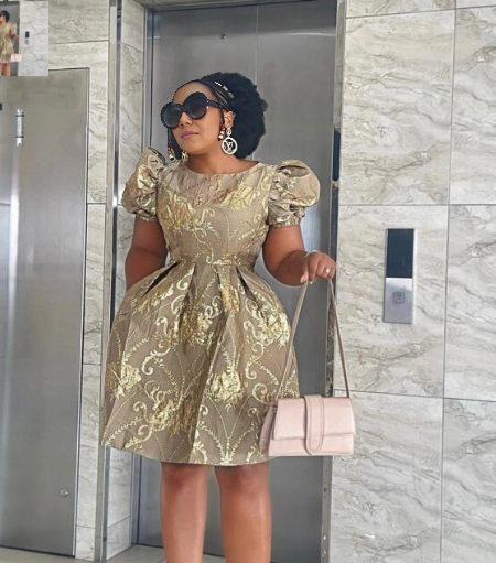 Gold a-line puff sleeve dress with detailed metallic embroidery and fitted bodice
