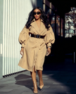 Tan puff-sleeve trench coat, double-breasted front with waist belt