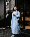 Sky-blue maxi double-breasted coat with notched lapels and button front