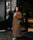 Brown maxi double-breasted coat with notched collar and front button closure