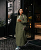 Army-green maxi double-breasted coat with notched lapels and button front