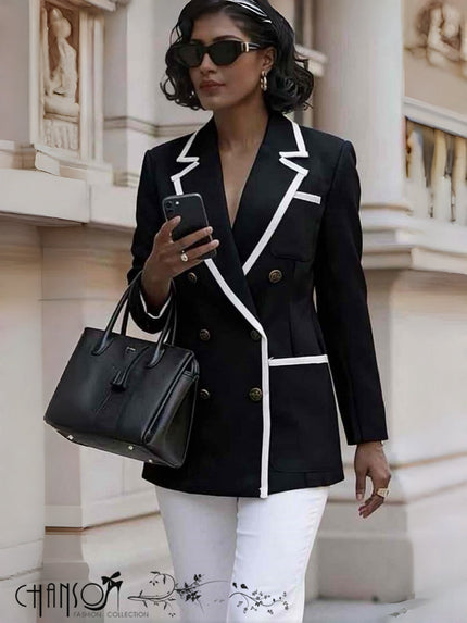 Black double-breasted blazer with contrast white piping, notched lapels and button front