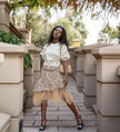 Layered skirt and puff-sleeve blouse set: cream-white blouse, beige printed skirt with tulle hem