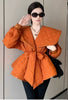 Orange puffy belted jacket with diamond quilting, wide collar and long sleeves