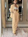 Creamy nude blazer and high-waist tie pants, long blazer with flap pockets
