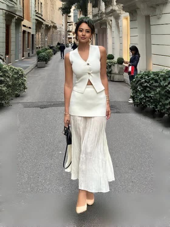 Ivory pleated midi skirt with matching sleeveless vest, V neckline and center-button detail