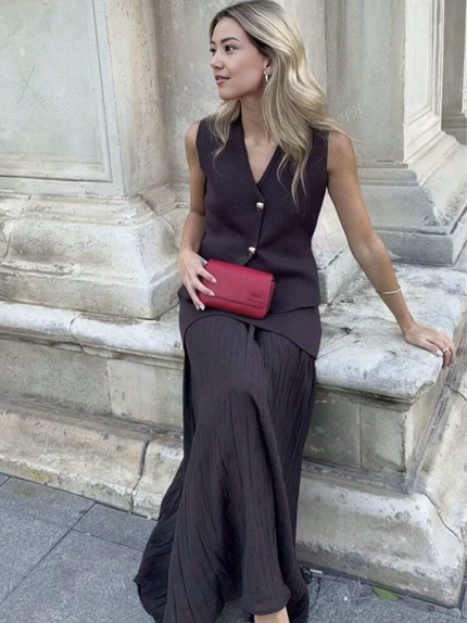 Dark pleated midi skirt with matching sleeveless vest, gold button front and V neckline