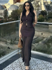 Black pleated midi skirt with matching sleeveless vest, gold button front and V neckline