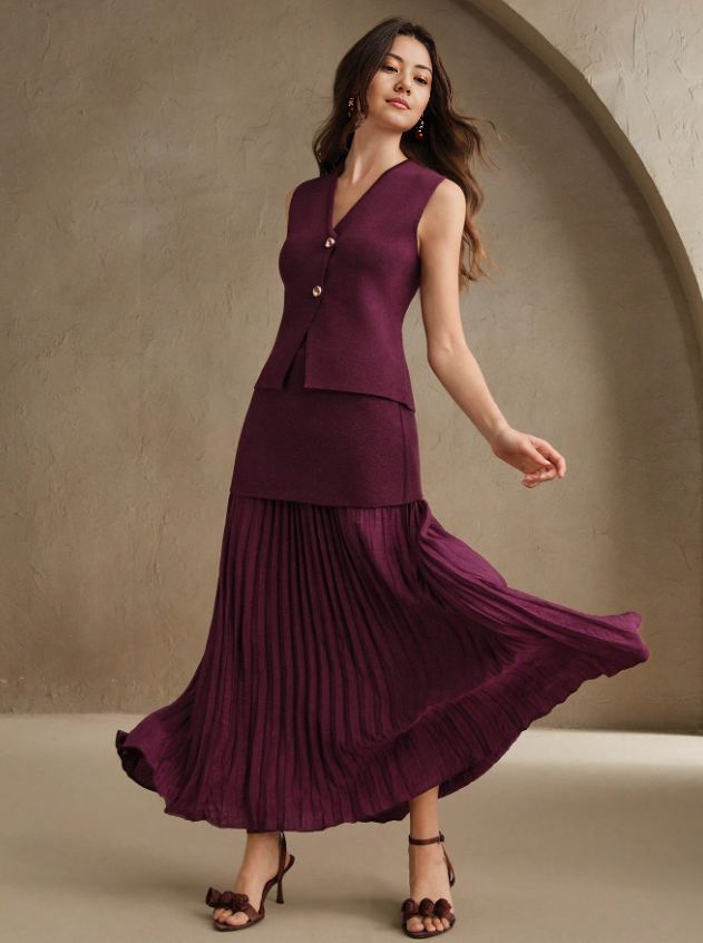 Maroon pleated midi skirt with matching sleeveless vest, gold buttons and V neckline