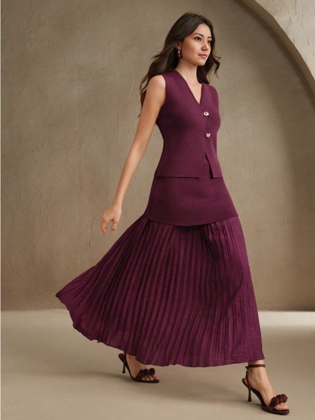Maroon pleated midi skirt with matching sleeveless vest, gold button detail and V neckline