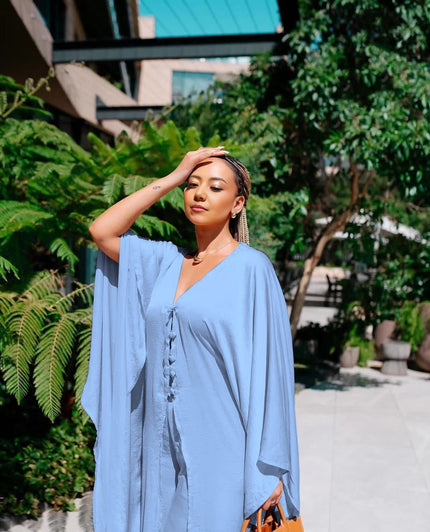 Wide-leg trousers in sky blue with relaxed fit and tie waist