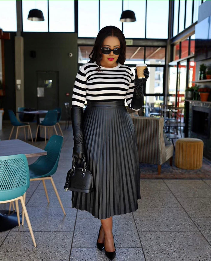 Pleated midi skirt with dark vertical pinstripes and full pleated silhouette