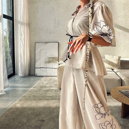 Cream blouse and wide-leg pants set with floral line-art embroidery and drawstring waist