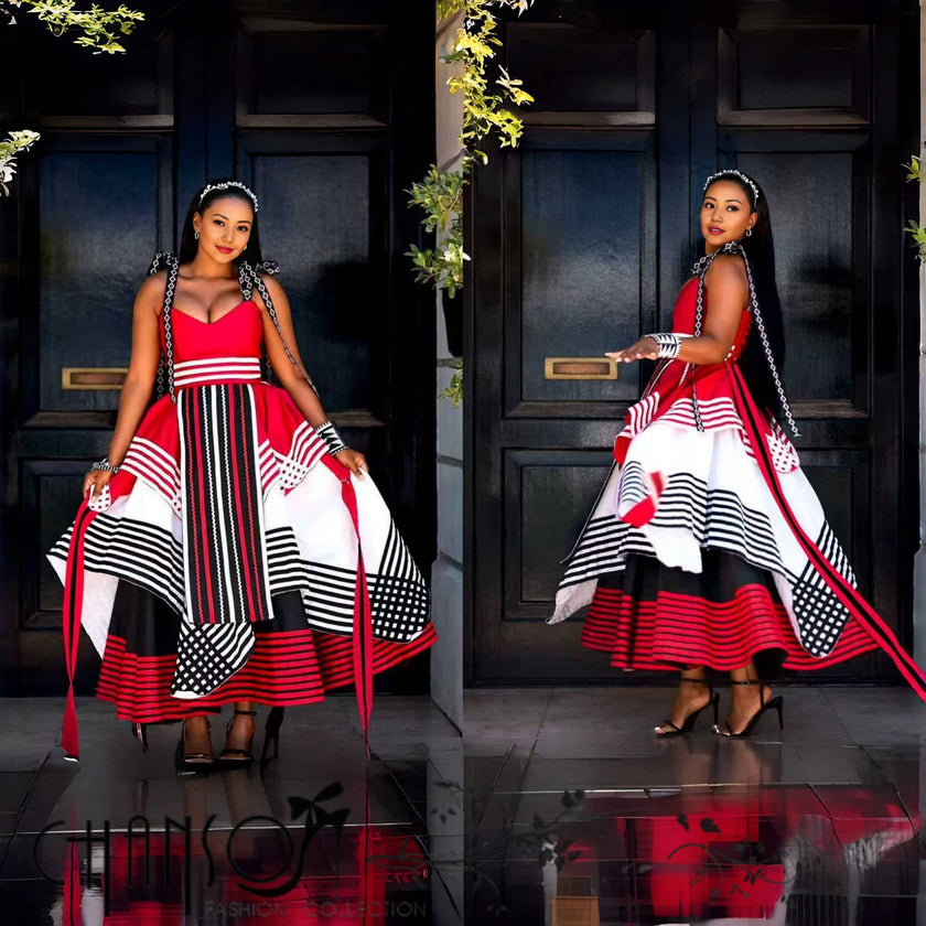 Geometric print maxi dress in red, white, and black; full flared skirt, strappy bodice