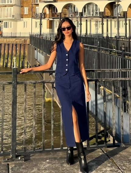 Light-blue denim mandarin-collar sleeveless vest with button front and long skirt slit