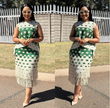 Green-and-white geometric fringe midi skirt with square block pattern