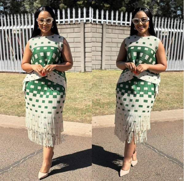 Green-and-white geometric fringe midi skirt with square block pattern