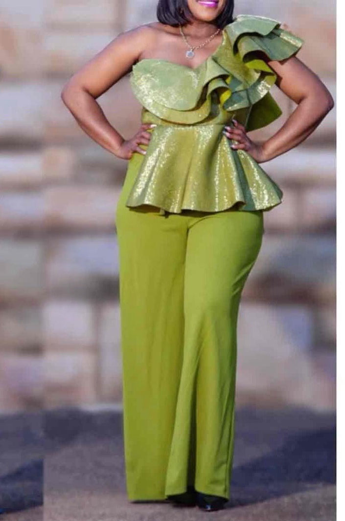 One-shoulder ruffle jumpsuit in lime green with layered peplum and wide-leg trousers.