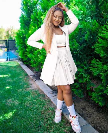 White blazer and pleated skirt twin set with crop top