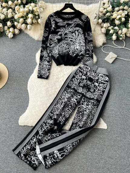 Botanical printed two-piece set: black long-sleeve top and wide-leg pants with white contrast trim