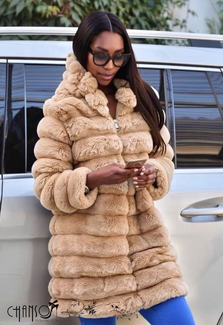 Nude hooded fur coat with full zip, thick shaggy texture and long sleeves