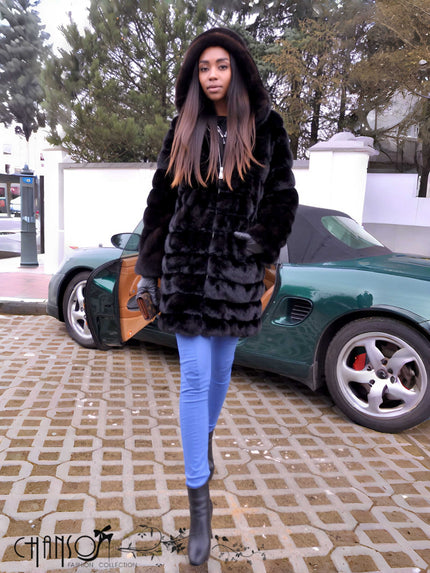 Black hooded faux-fur coat with zip front and chunky textured sleeves