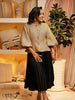 Gold tweed puff-sleeve blouse with button front and round neckline