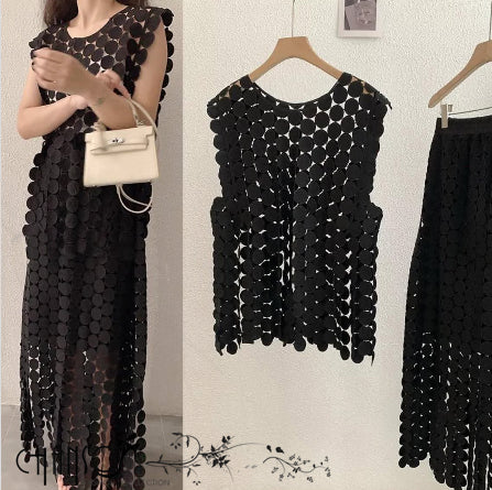 Black geometric sequin twin set dress on hanger, sleeveless with scalloped shoulders