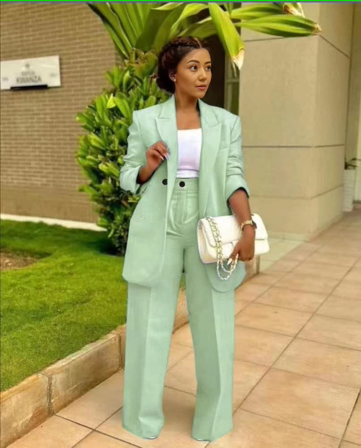 Pale green structured blazer and straight-leg trouser suit set, single-breasted front