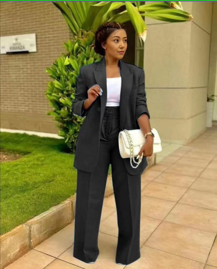 Black structured blazer and straight-leg trouser suit set, single-breasted front