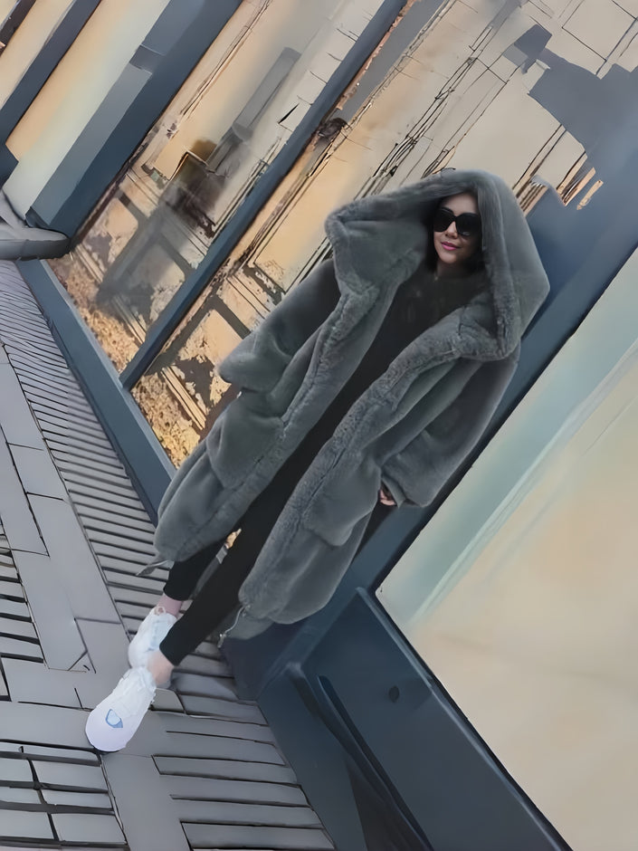 Grey plush hooded coat with thick texture, layered pockets, relaxed fit