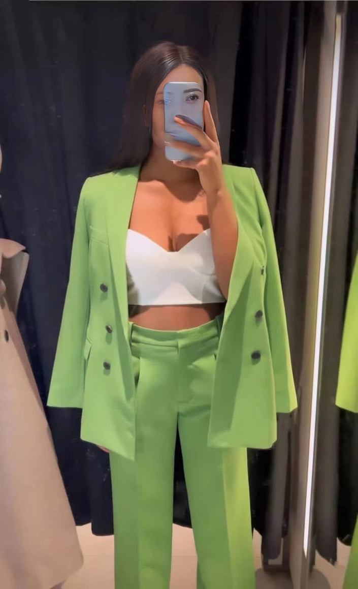 Green double-breasted blazer suit with matching trousers and black buttons