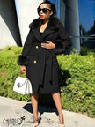 Black belted coat with fur-trimmed collar and sleeves, gold buttons, tie waist.