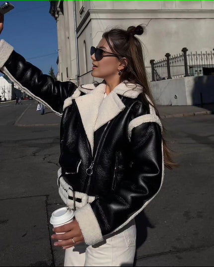 Shearling biker jacket in black with zip front and white fleece trim, belted cuffs
