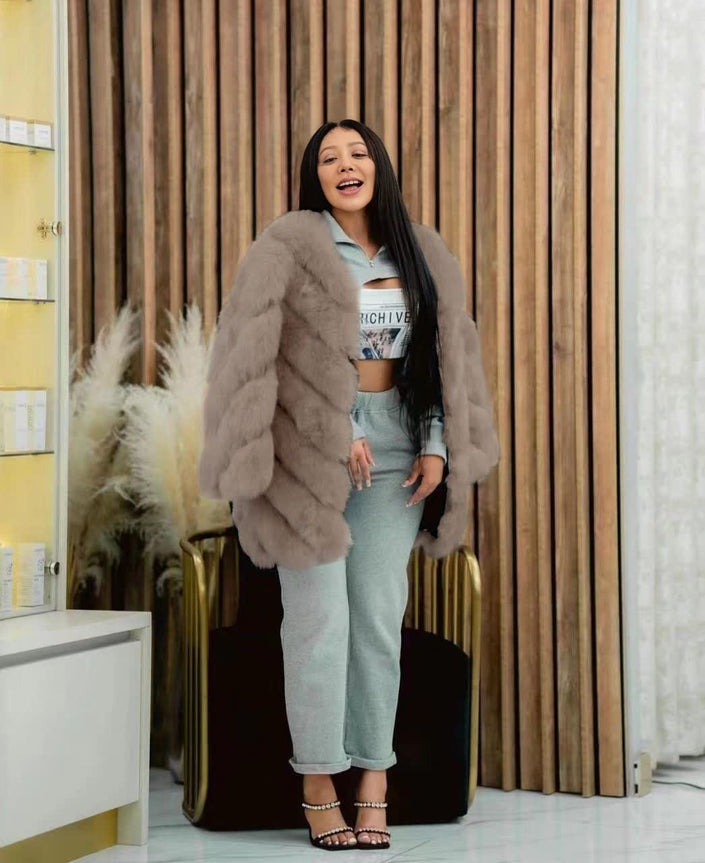 Grey plush fur coat with puffy sleeves, open front, mid-length.