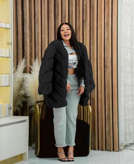 Black plush fur coat with puffy sleeves, open front, mid-length.