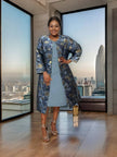Light blue midi dress with blue floral jacket layer, elbow sleeves and open front