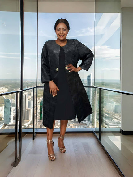 Black midi dress with matching textured jacket layer, elbow sleeves and buttonless front