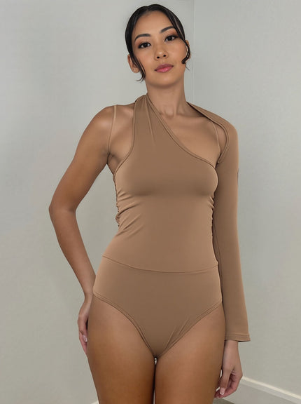 Tan one-shoulder long-sleeve bodysuit with asymmetrical neckline and high-cut leg