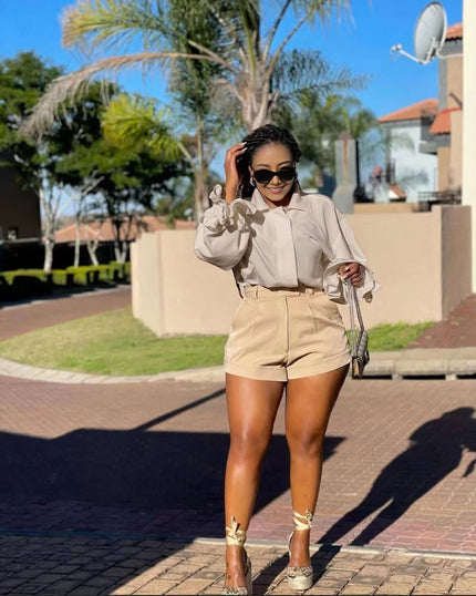 High-neck puff-sleeve blouse in cream with ruffled cuffs and gathered shoulders