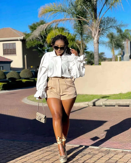 High-neck puff-sleeve blouse in white with ruffled cuffs and gathered shoulders