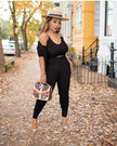 Black knit three-piece set: cropped top, cardigan, and fitted capri pants